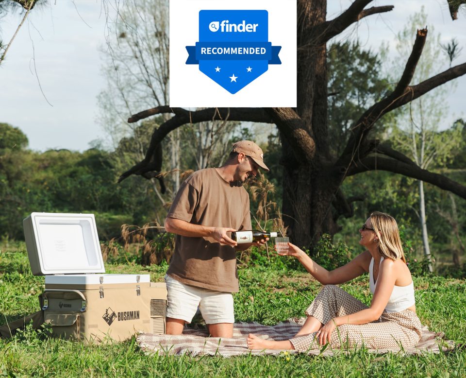 Couple enjoying glass of wine outdoors from their bushman fridge